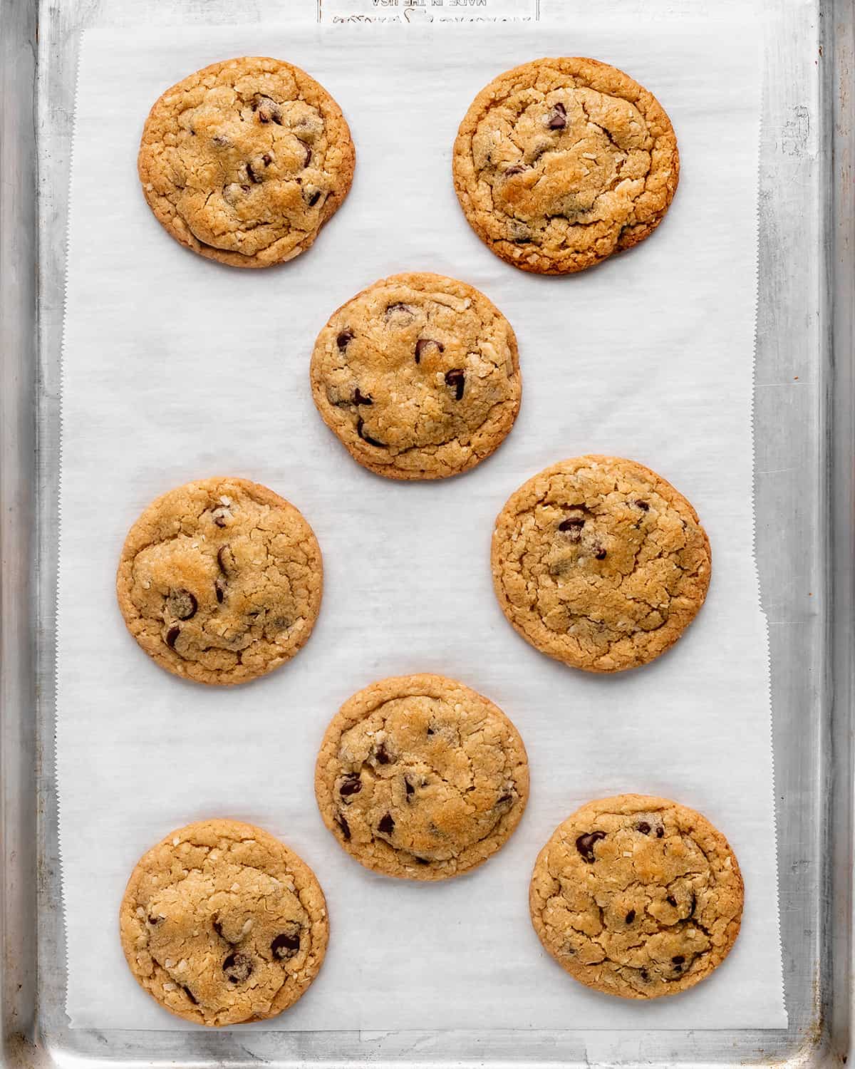 9 Coconut Chocolate Chip Cookies on a baking sheet after baking