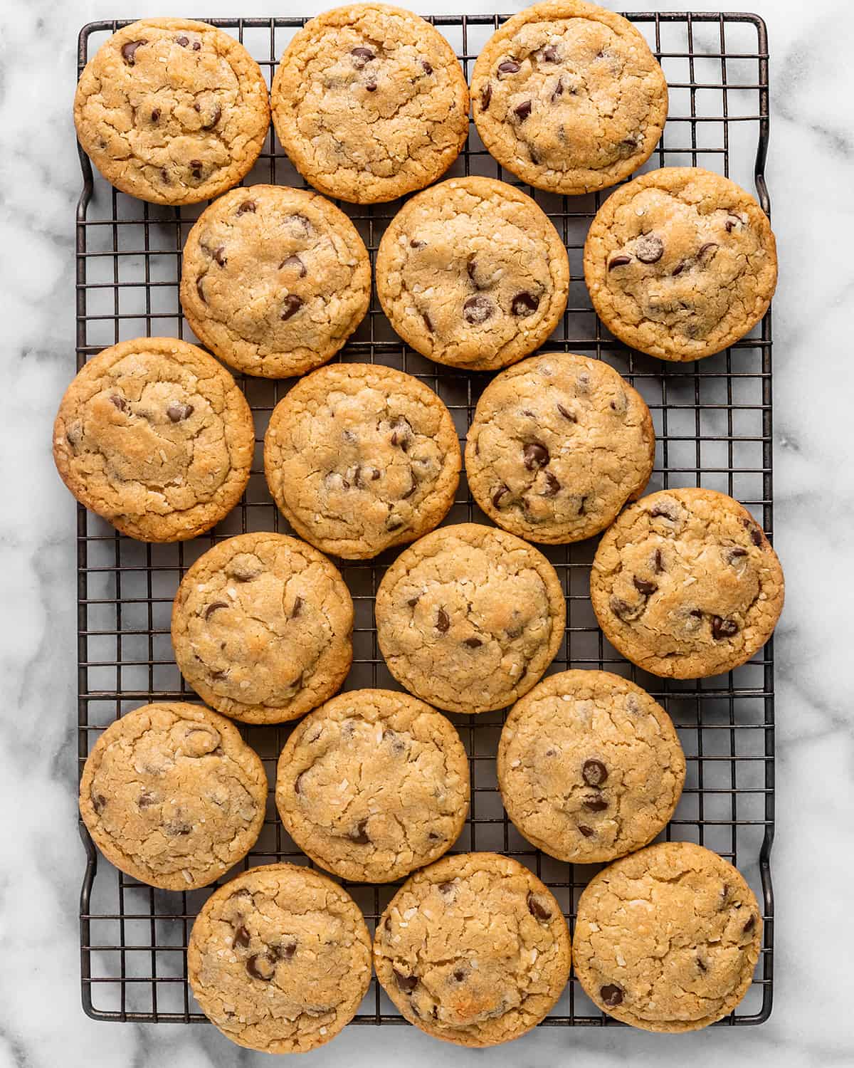 18 Coconut Chocolate Chip Cookies on a wire cooling rack