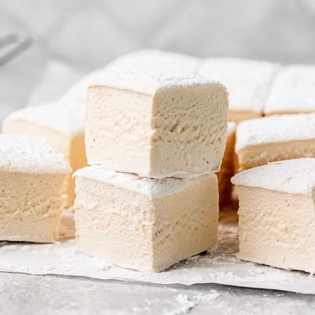 a stack of 2 Homemade Marshmallows surrounded by other marshmallows