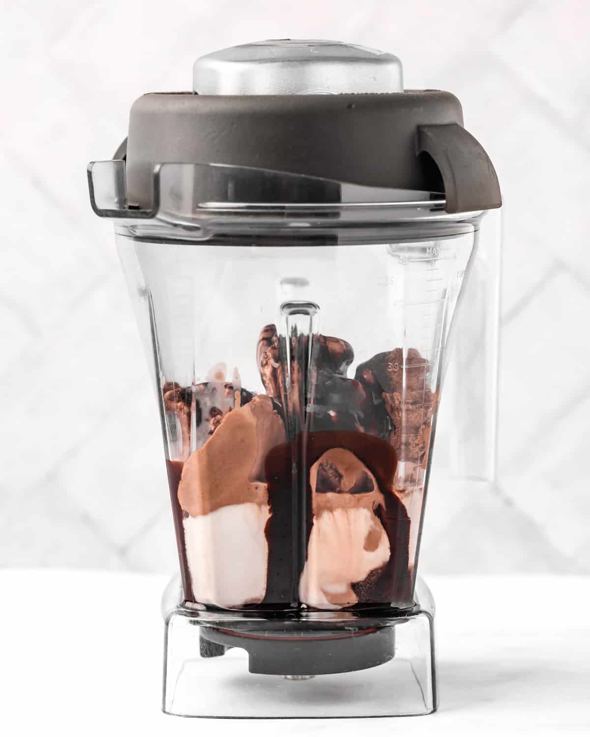 how to make a chocolate milkshake - ingredients in a blender before blending