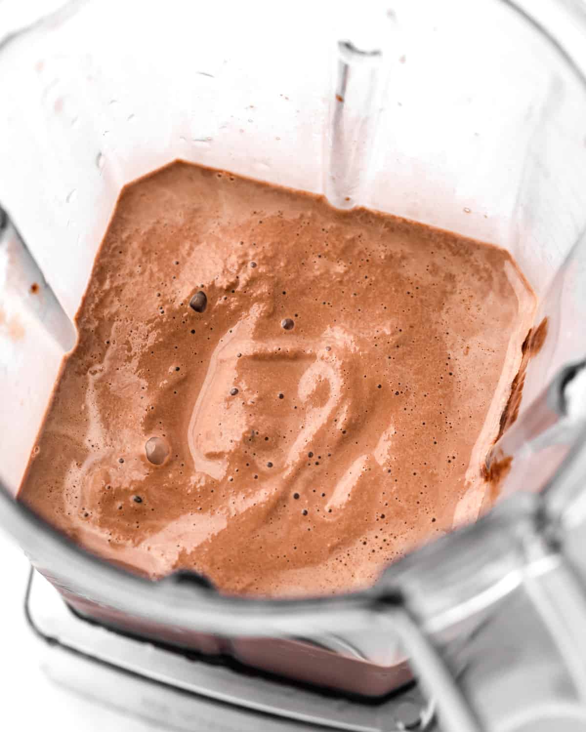 how to make a chocolate milkshake - ingredients in a blender after blending