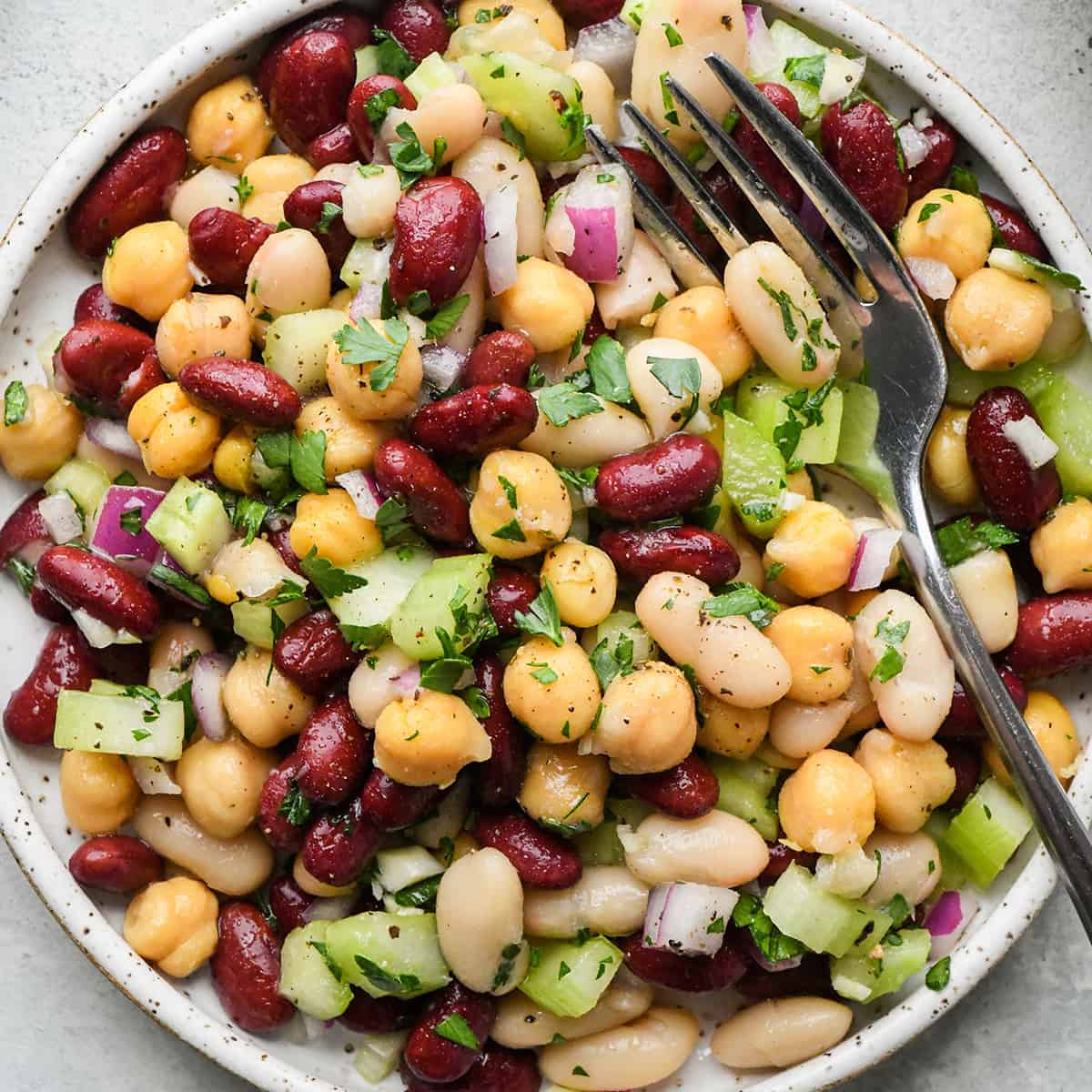 3 Bean Salad on a plate with a fork