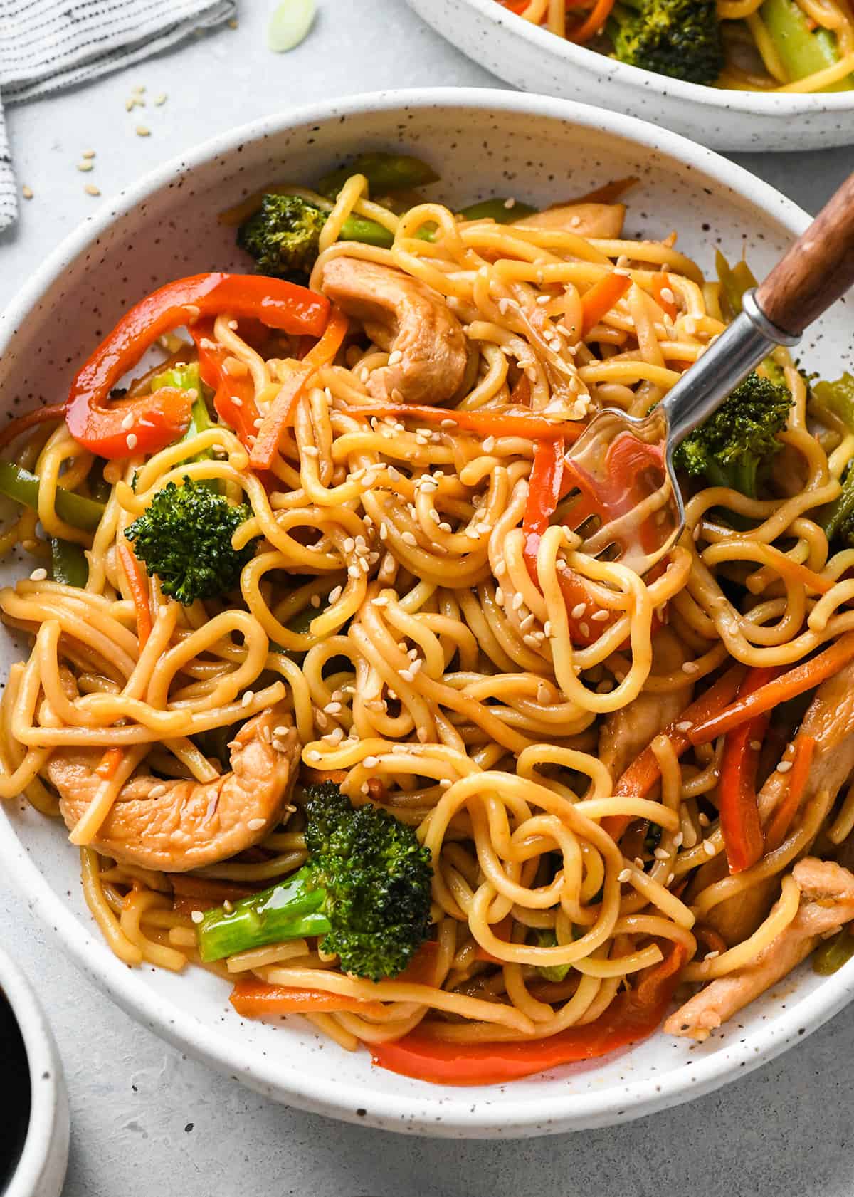 Chicken Lo Mein in a bowl with a fork