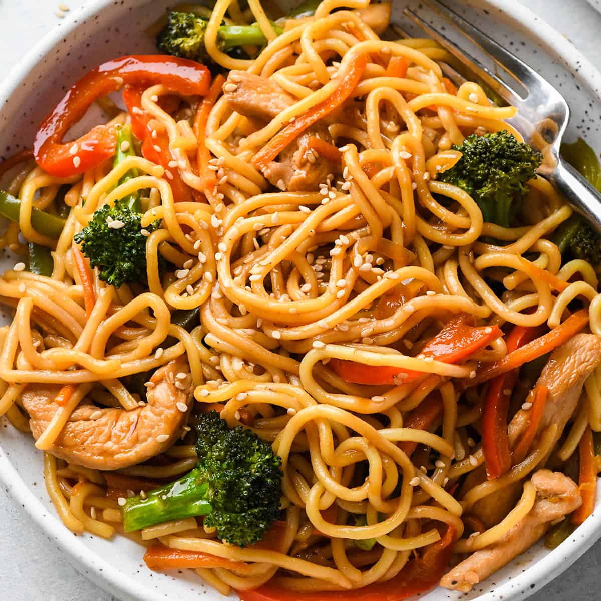 Chicken Lo Mein on a plate with a fork