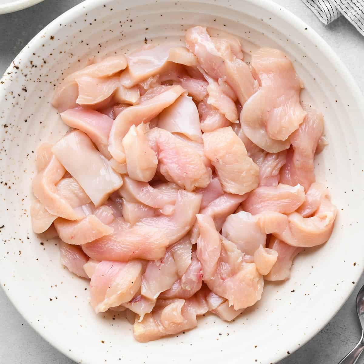 chicken cut up in a bowl to make Chicken Lo Mein