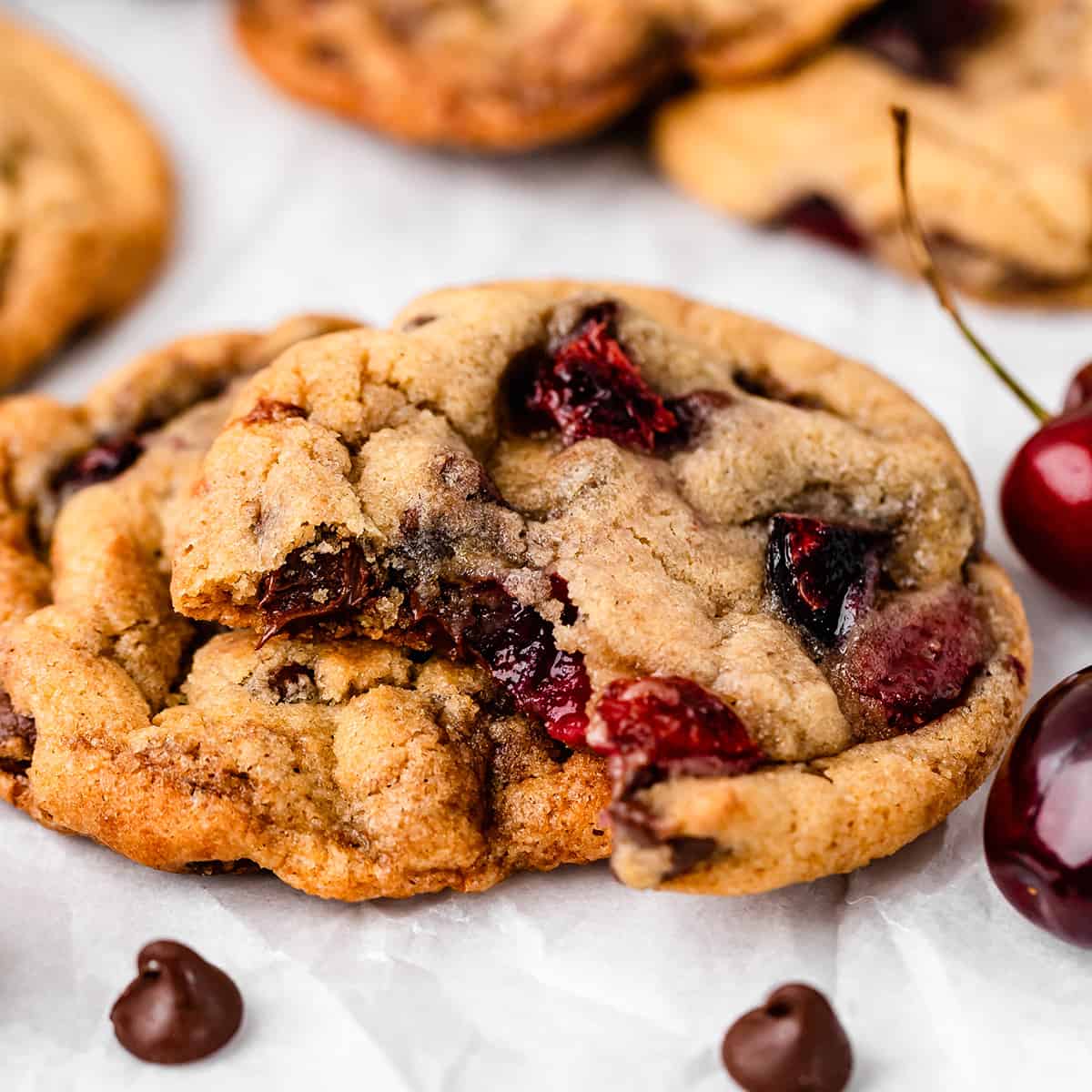 two Cherry Cookies, one with a bite taken out of it