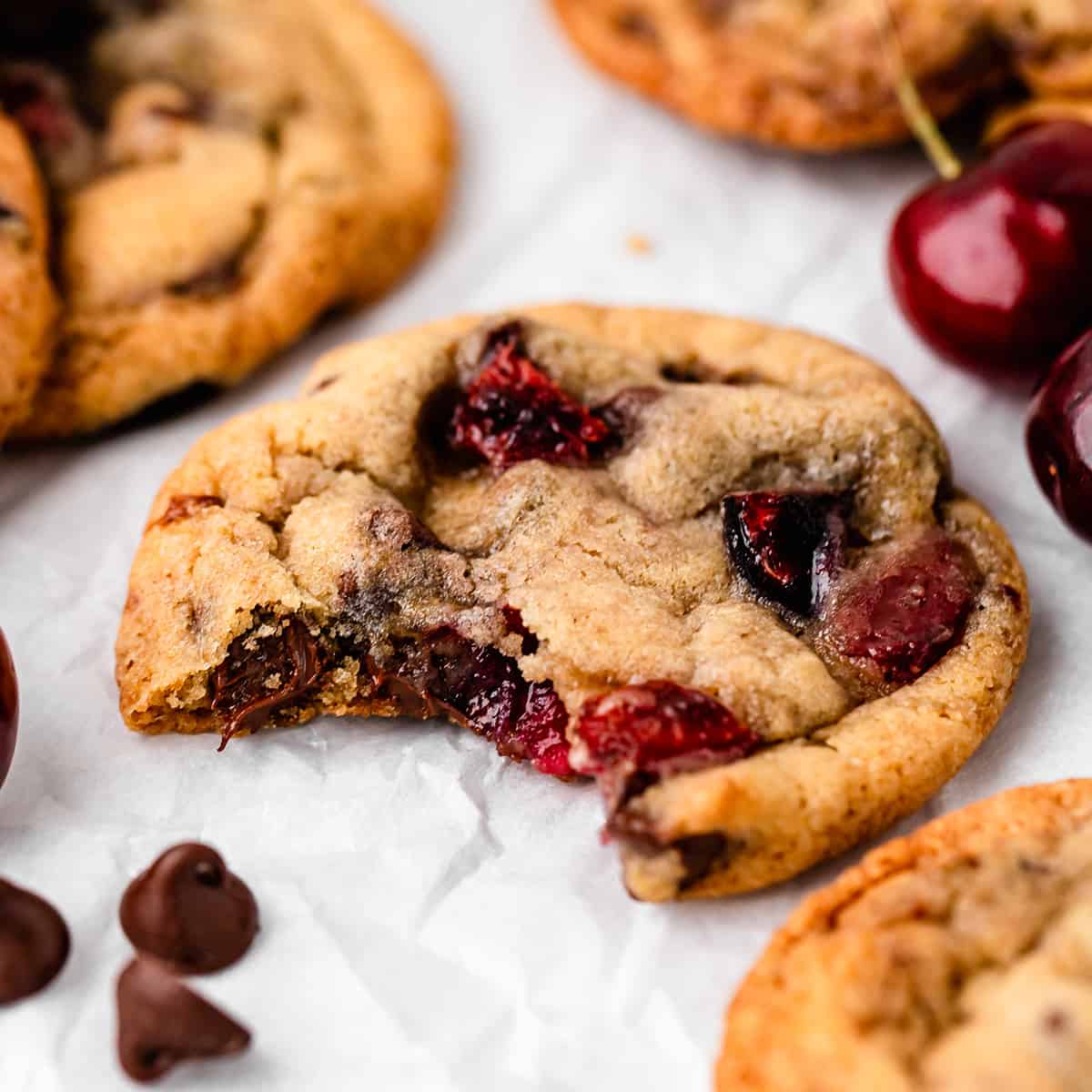 a cherry cookie with a bite taken out of it