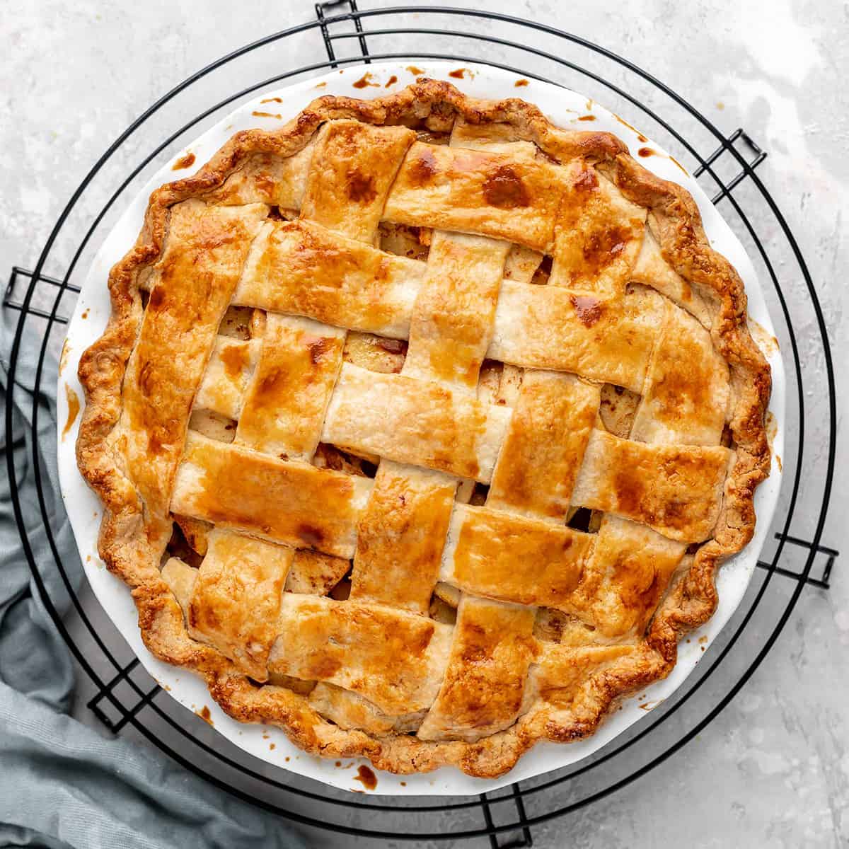 a baked Apple Pie on a wire cooling rack
