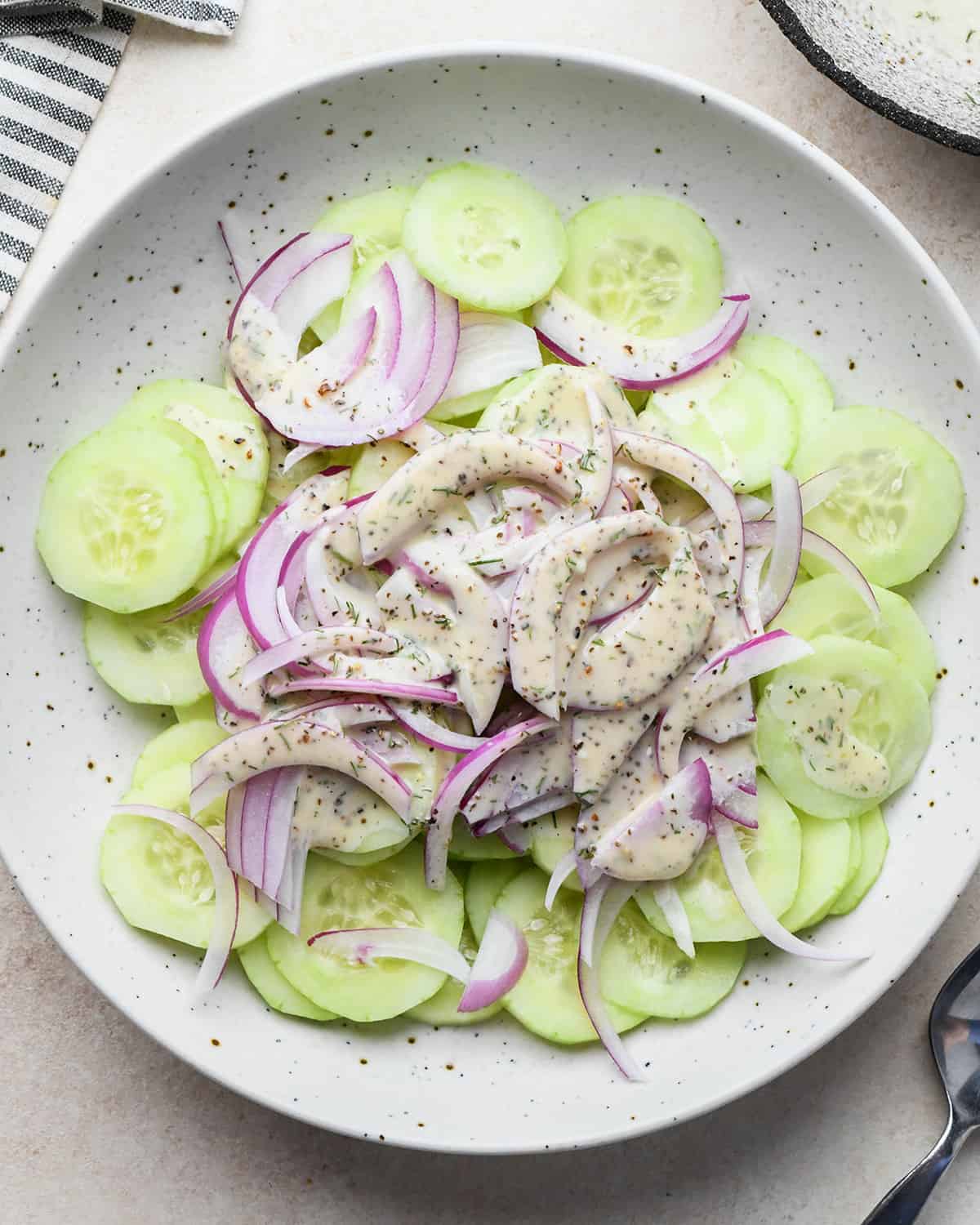 How to make Cucumber Salad - ingredients in a bowl before mixing 