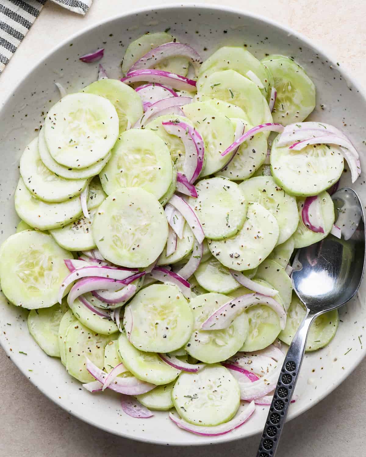 How to make Cucumber Salad - ingredients in a bowl after mixing 