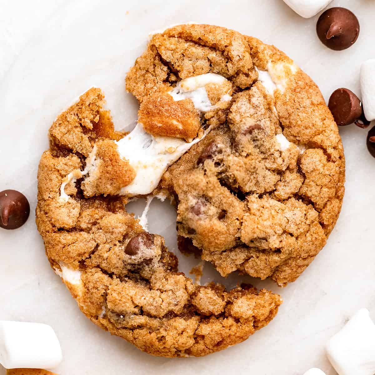 overhead photo of a s'mores cookie pulled apart in half 