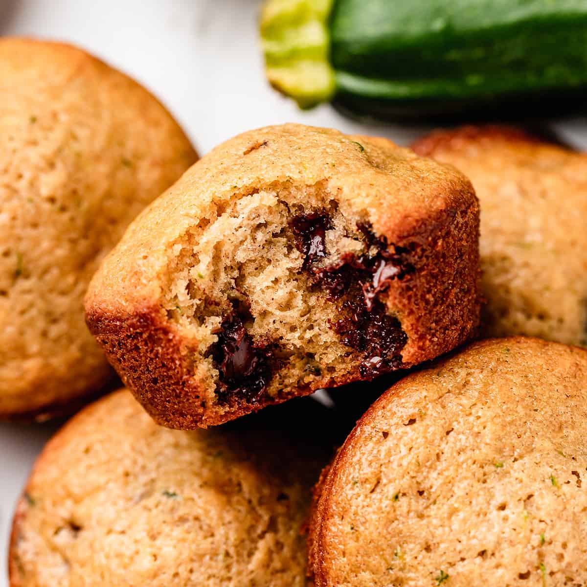 Zucchini Chocolate Chip Muffin with a bite taken out of it