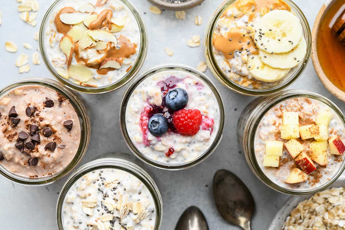 overhead photo of 6 jars of Overnight Oats, all different flavors. 