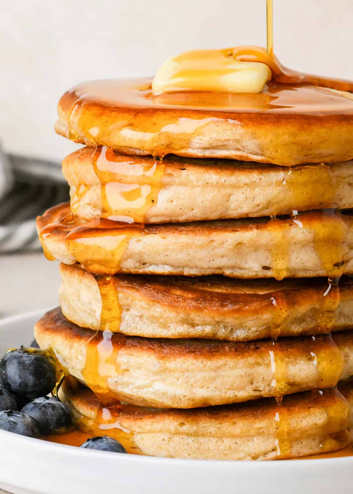 a stack of 6 pancakes made with Homemade Pancake Mix topped with butter and syrup
