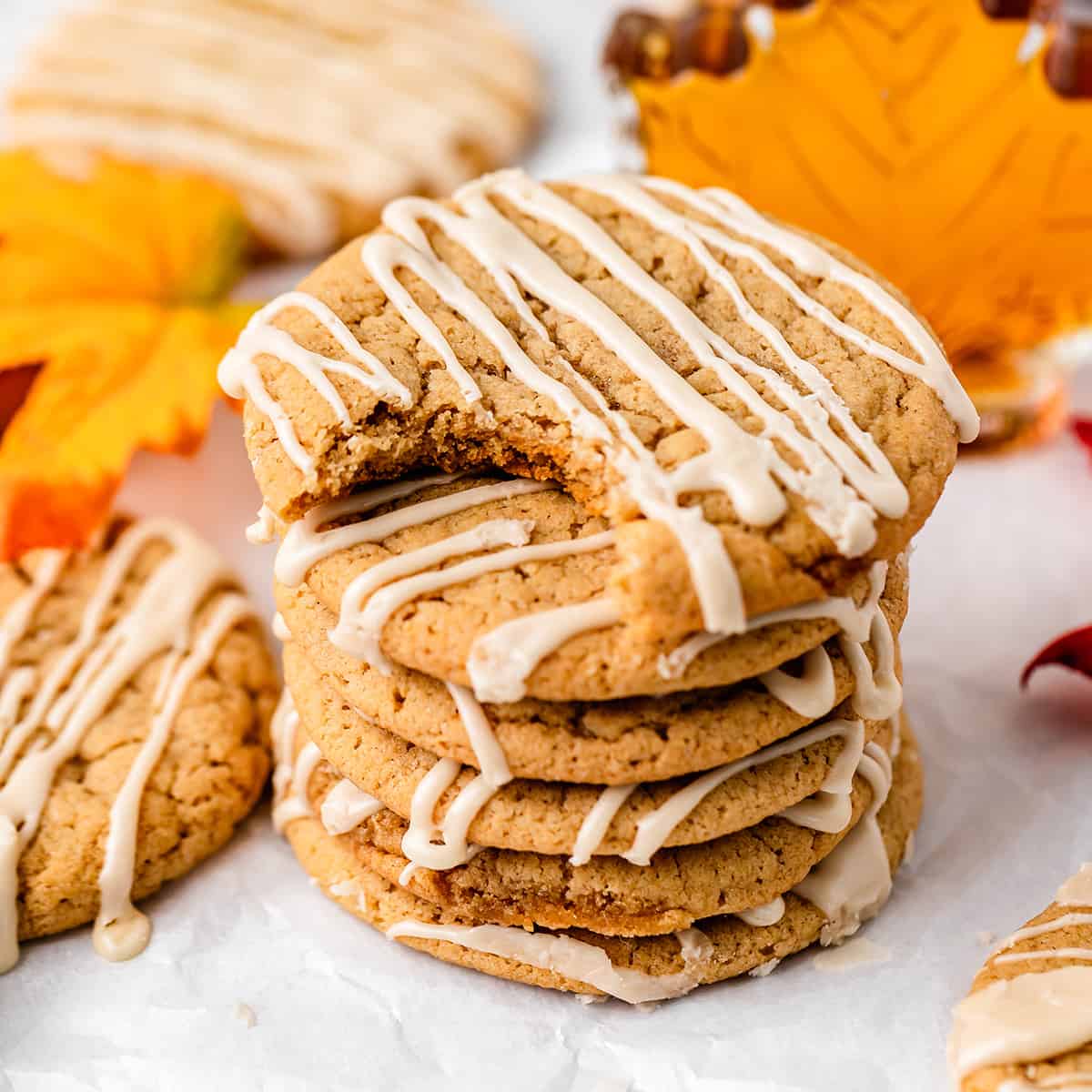 a stack of 6 Maple Cookies, the tope one has a bite taken out of it