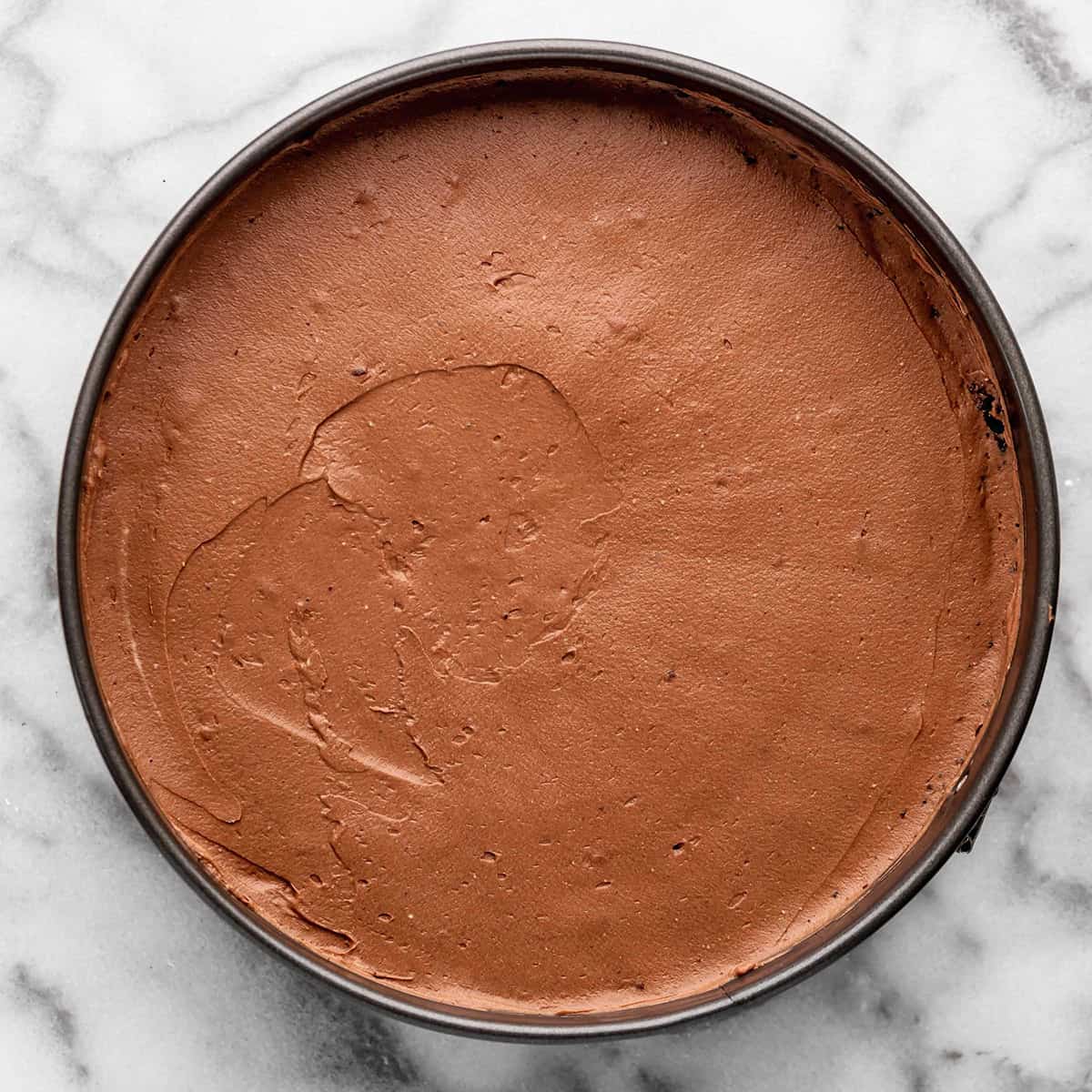 No Bake Chocolate Cheesecake filling spread into the prepared crust in a pan
