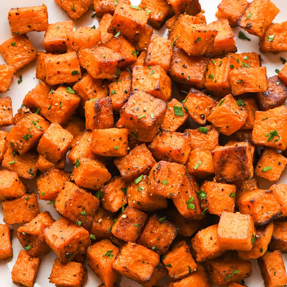  Oven Roasted Sweet Potatoes garnished with parsley