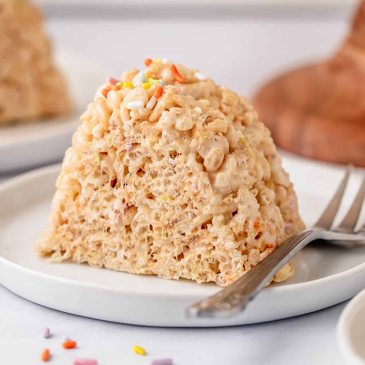 a piece of Rice Crispy Cake on a plate with a fork