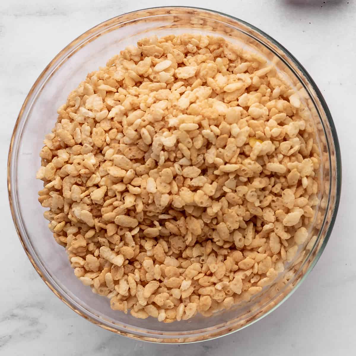 rice crispy cereal measured out into a glass bowl