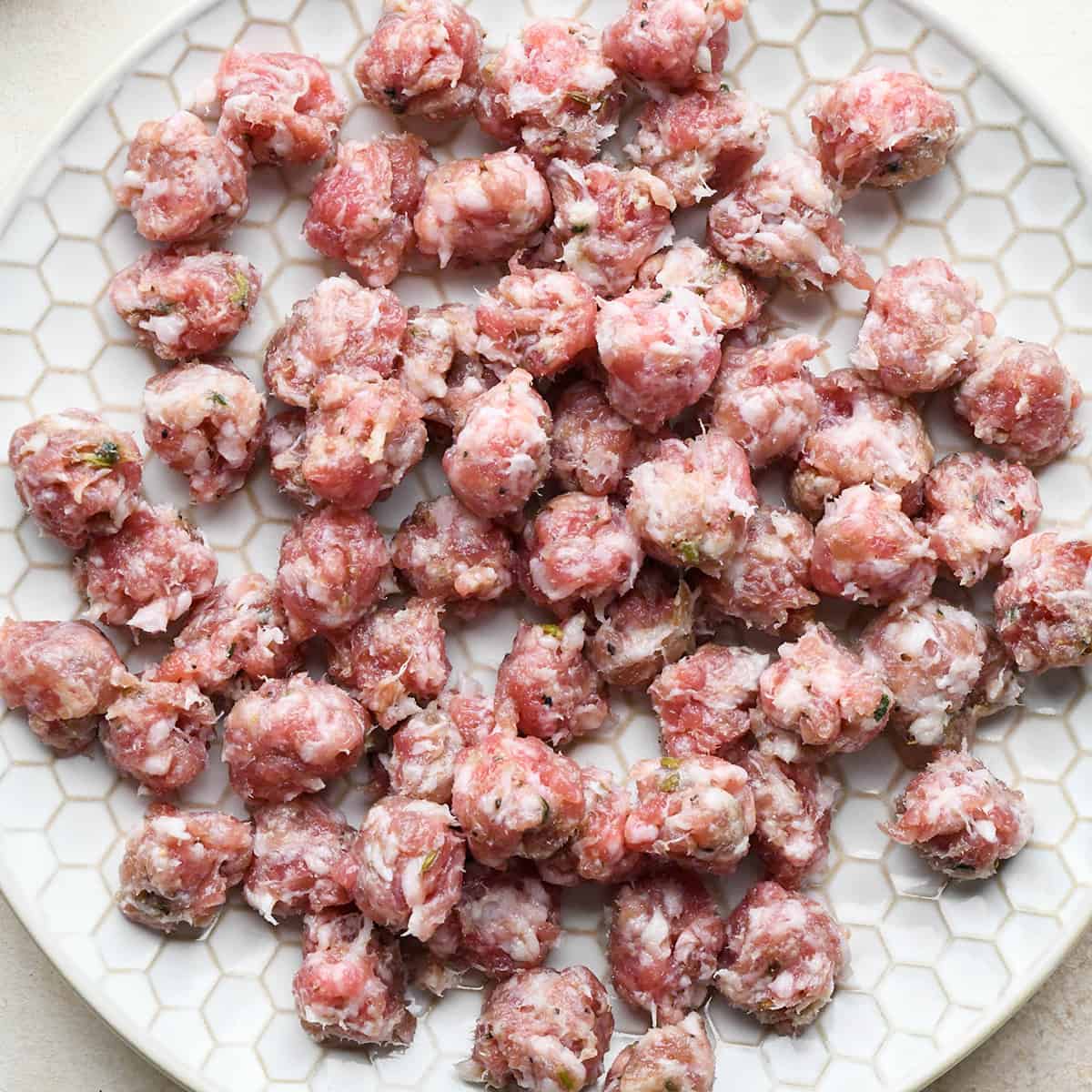 sausage on a plate before baking