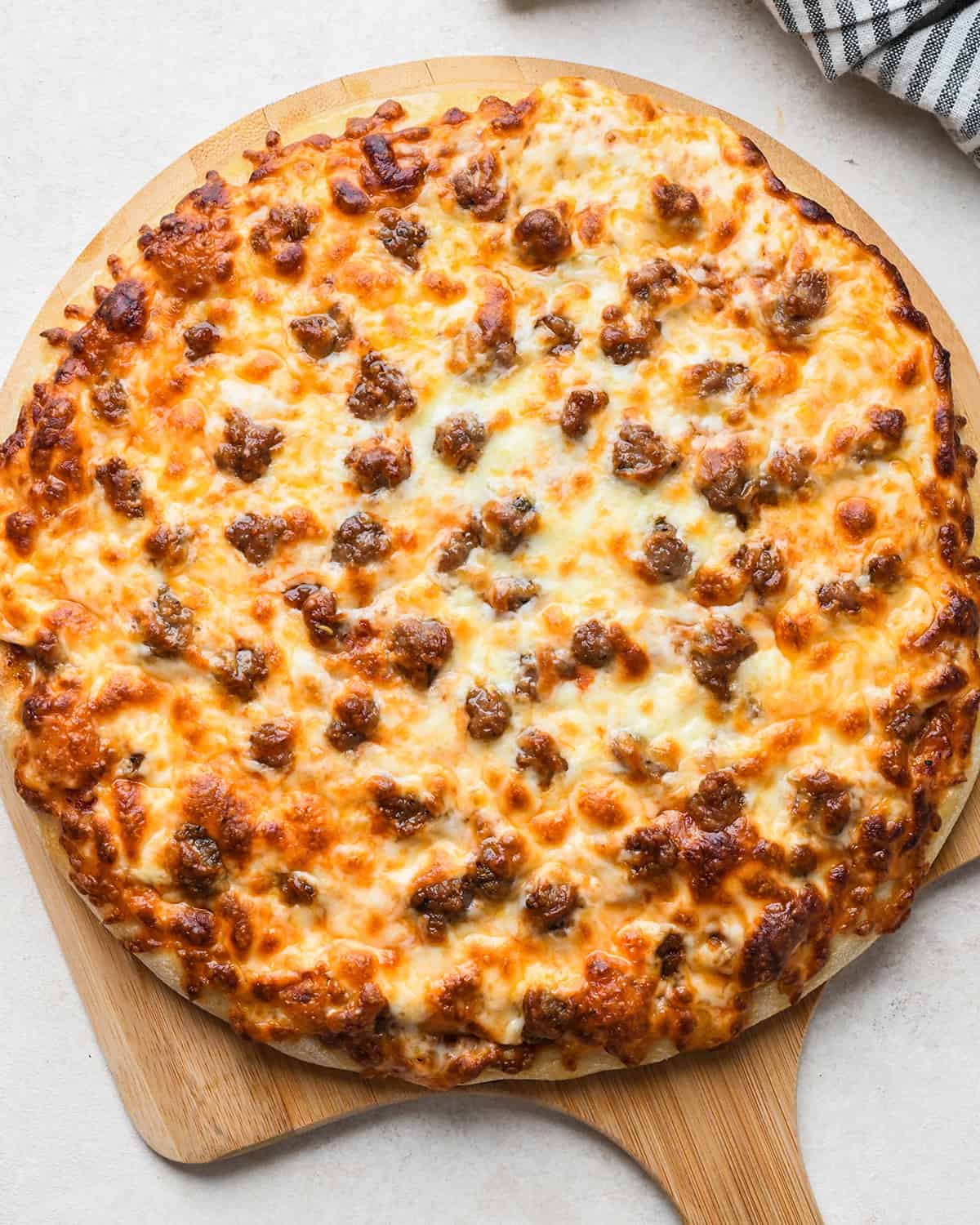 Sausage Pizza after baking on a pizza peel