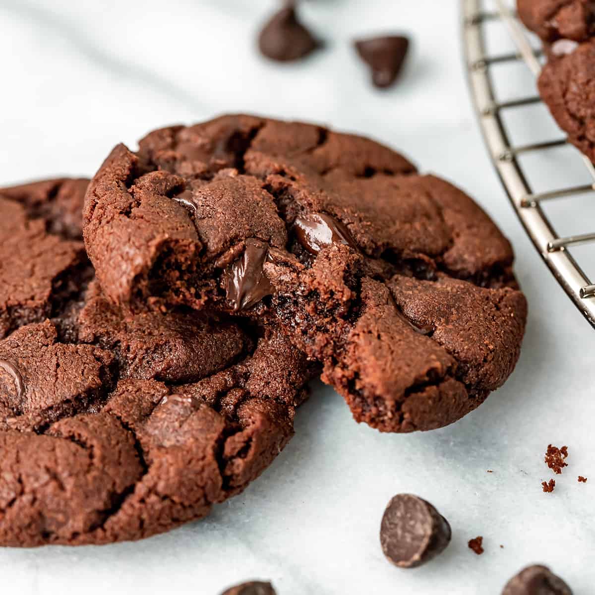 two Nutella Cookies, one with a bite taken out of it