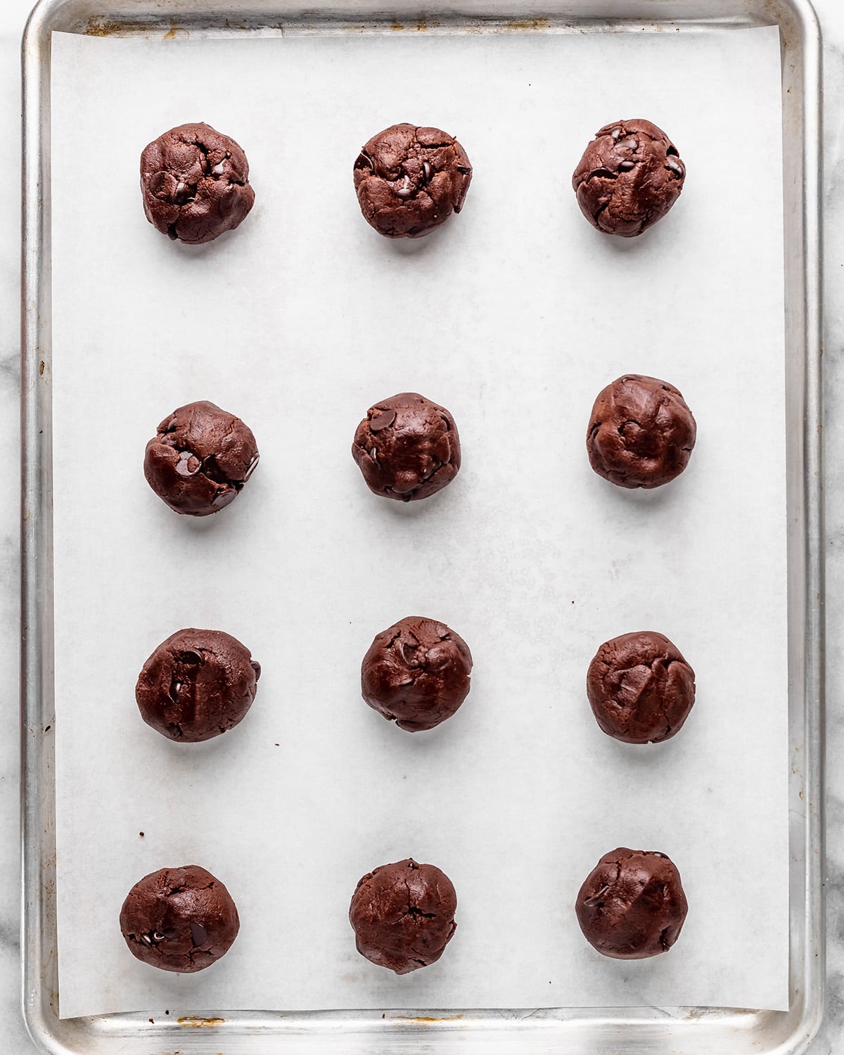 12 Nutella Cookie dough balls on a baking sheet before baking