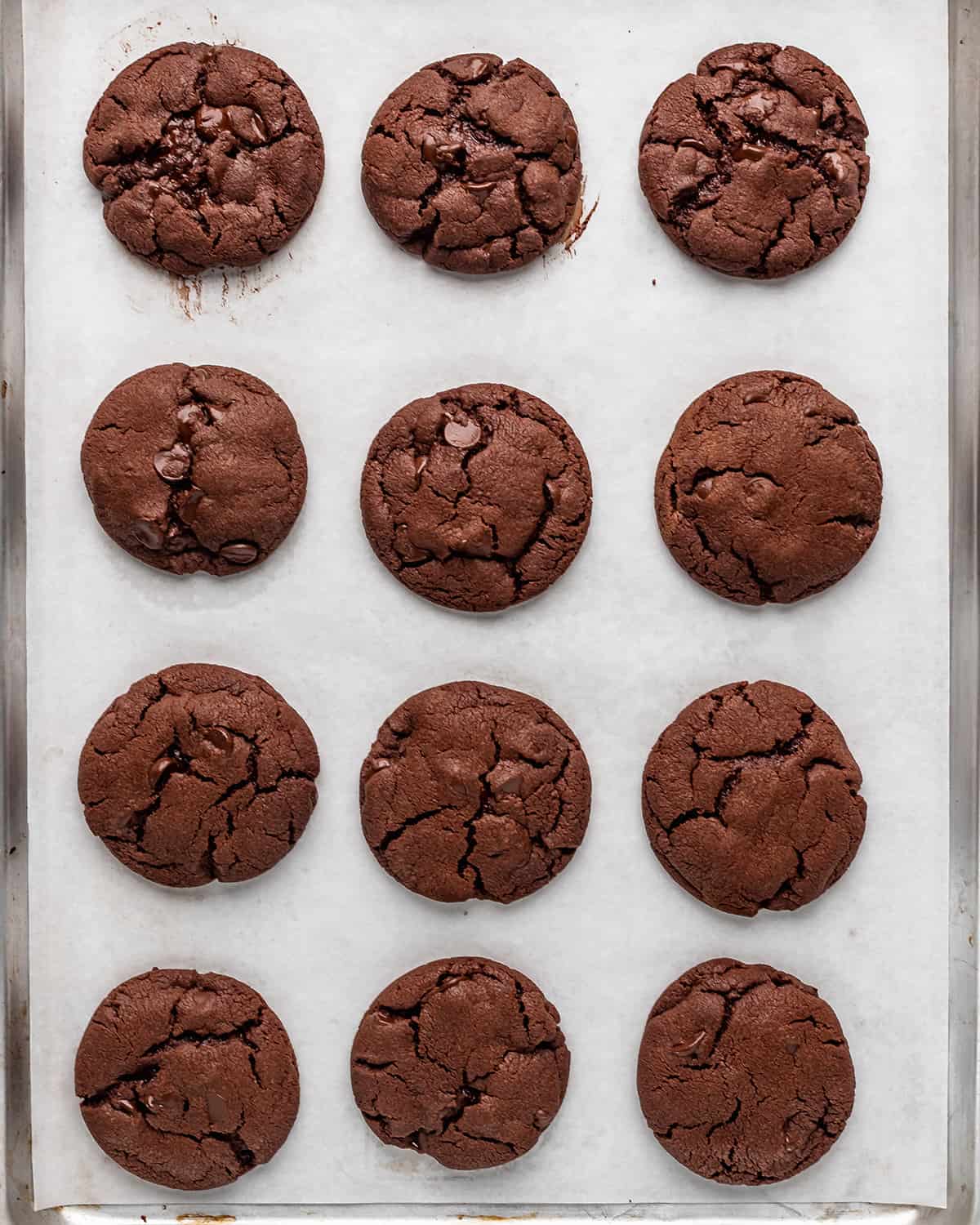 12 Nutella Cookies on a baking sheet after baking