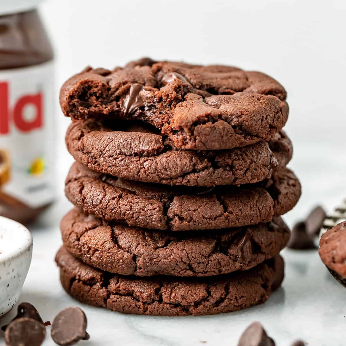 a stack of 5 Nutella Cookies, the top one has a bite taken out of it