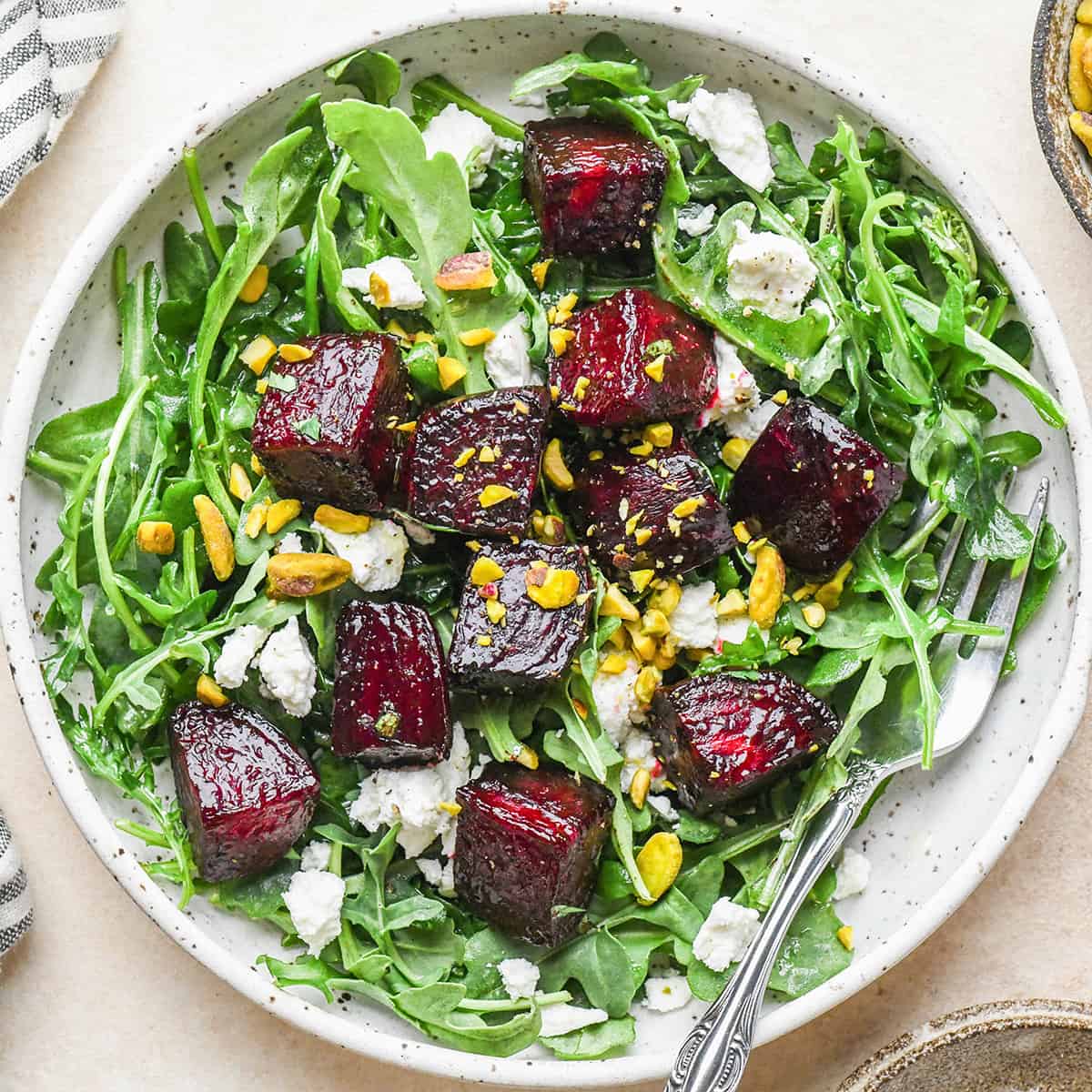 oven roasted beets on top of a salad