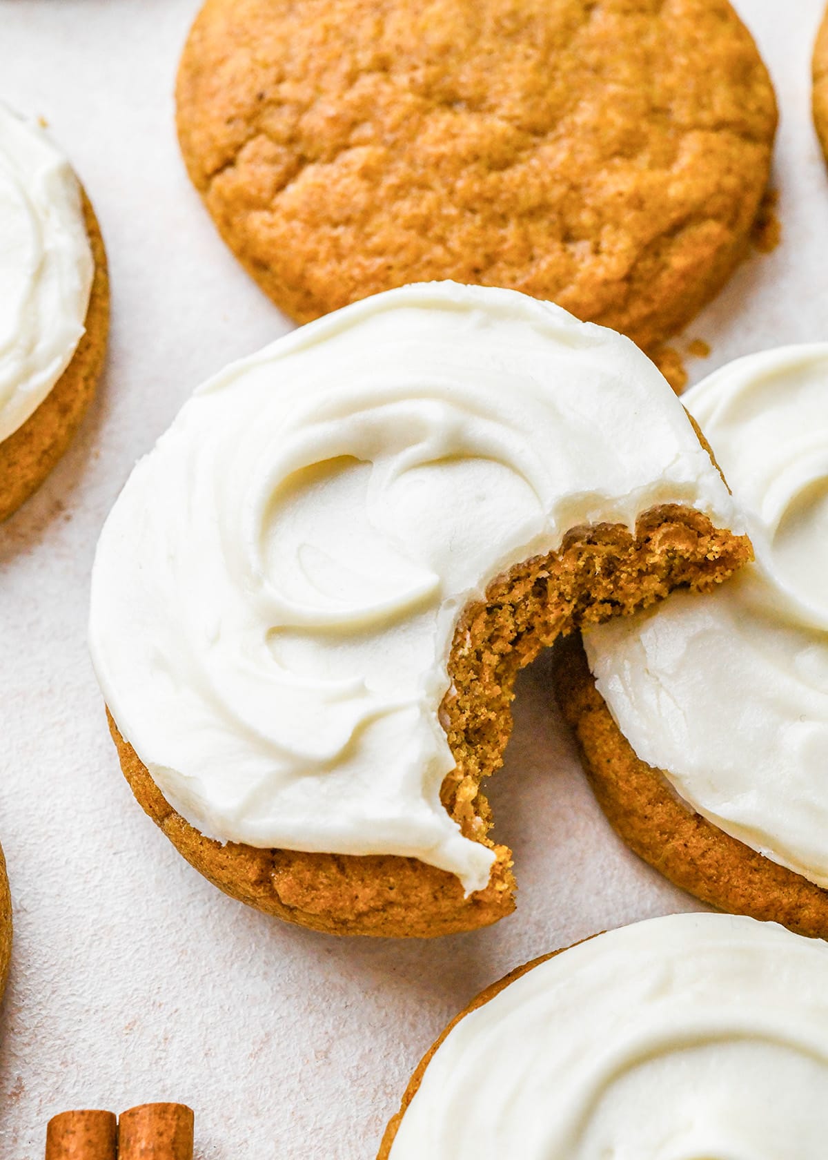 5 Pumpkin Cookies, one with a bite taken out of it