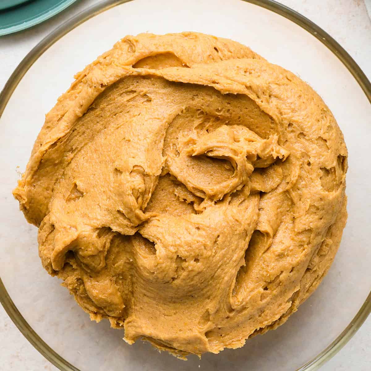 pumpkin cookies dough in a glass tupperware to be chilled