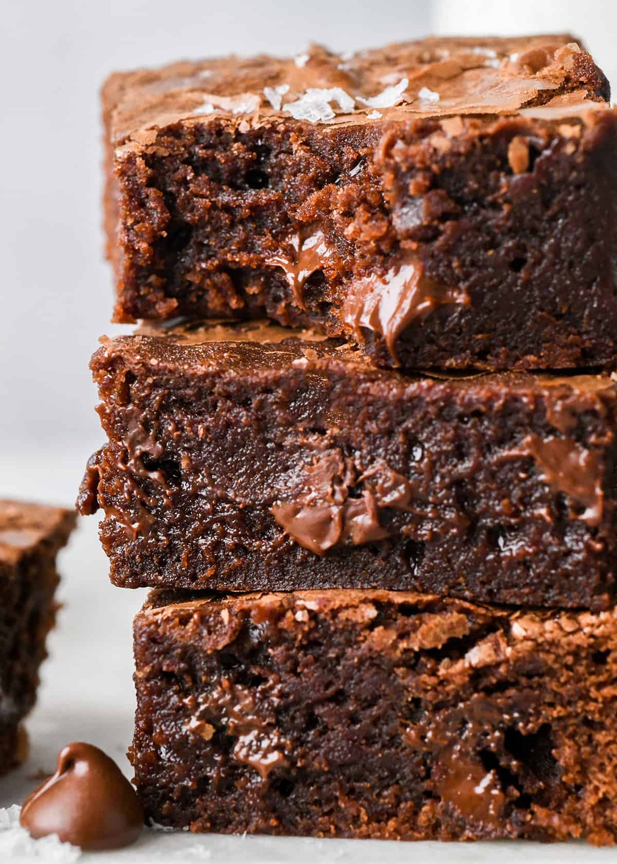 stack of 3 Small Batch Brownies, the top one with a bite taken out of it