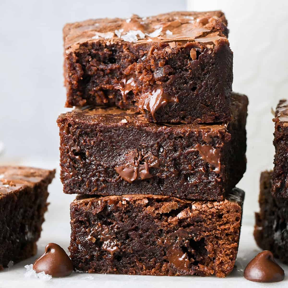 a stack of 3 Small Batch Brownies, the top one has a bite taken out of it