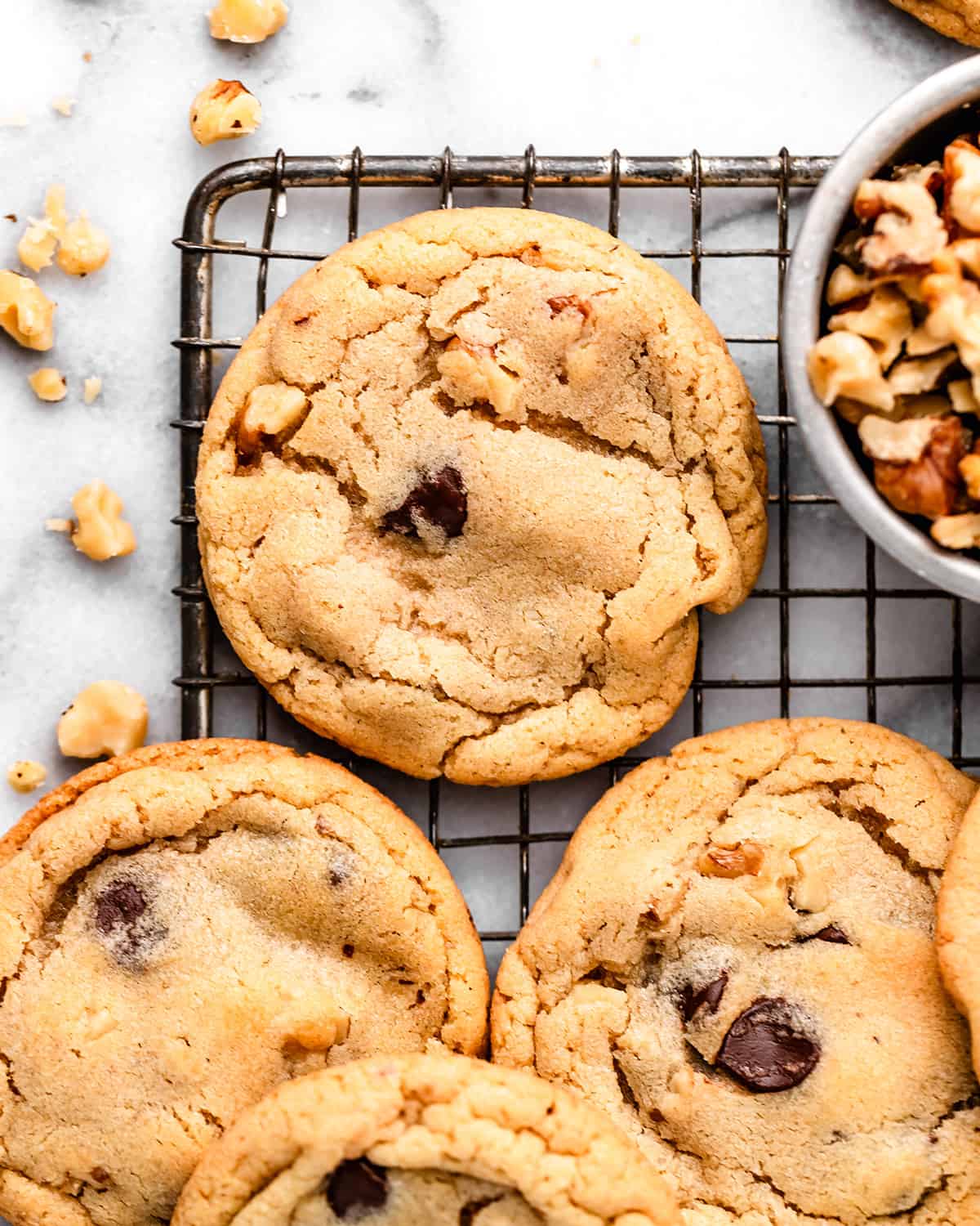 4 Chocolate Chip Walnut Cookies on a wire cooling rack