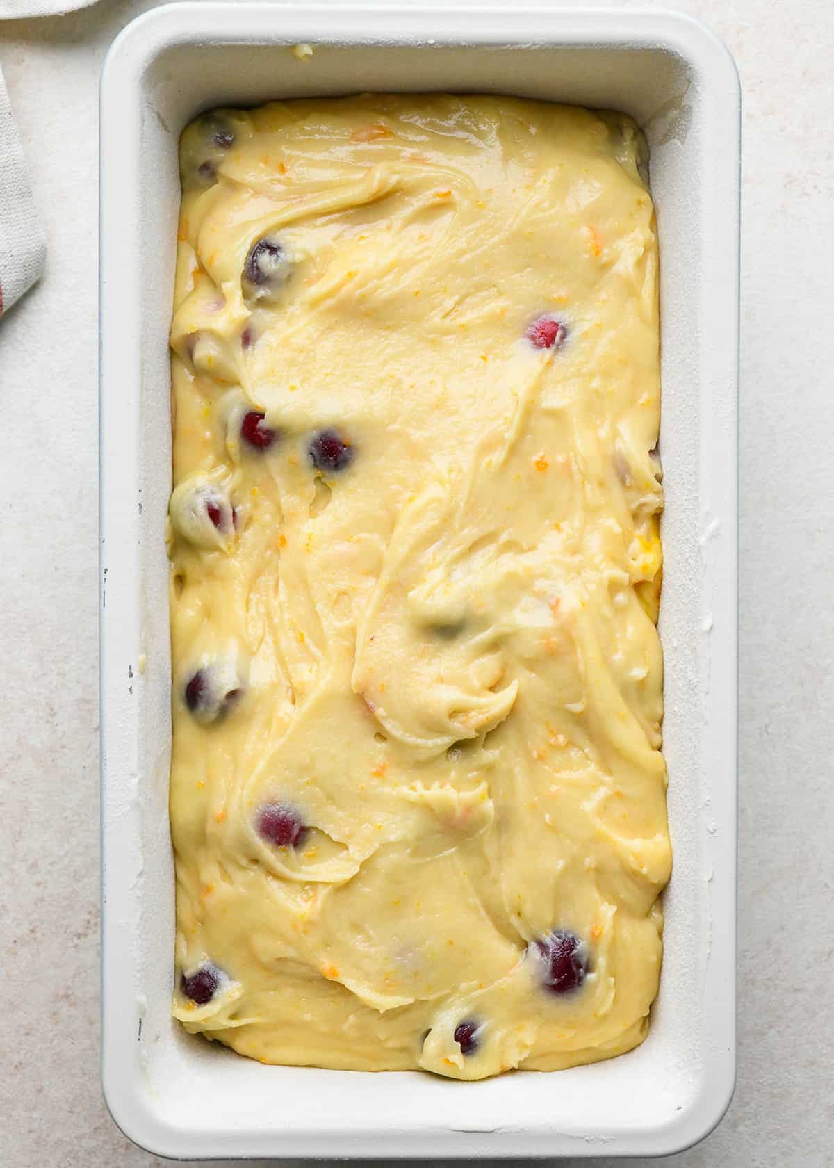 Cranberry Orange Bread in a loaf pan before baking