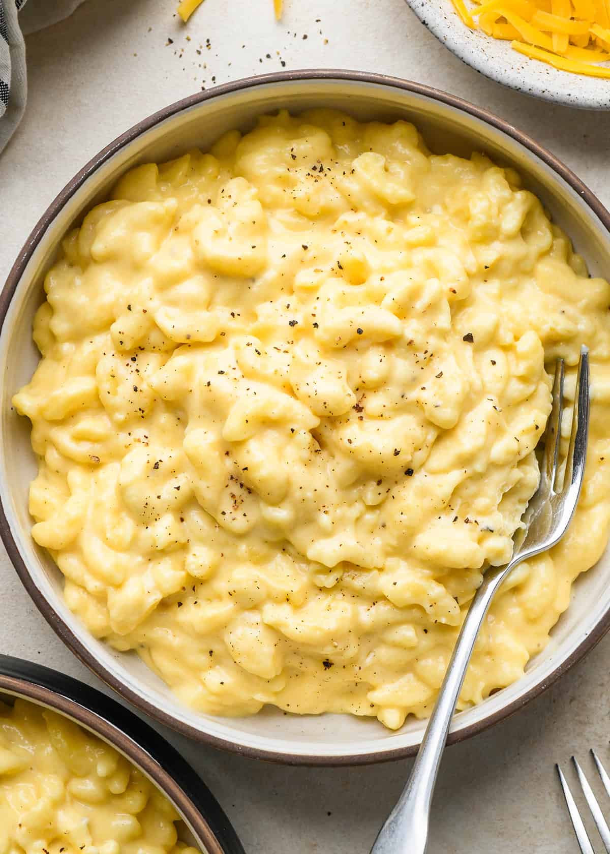 a bowl of Crock Pot Mac and Cheese with a fork