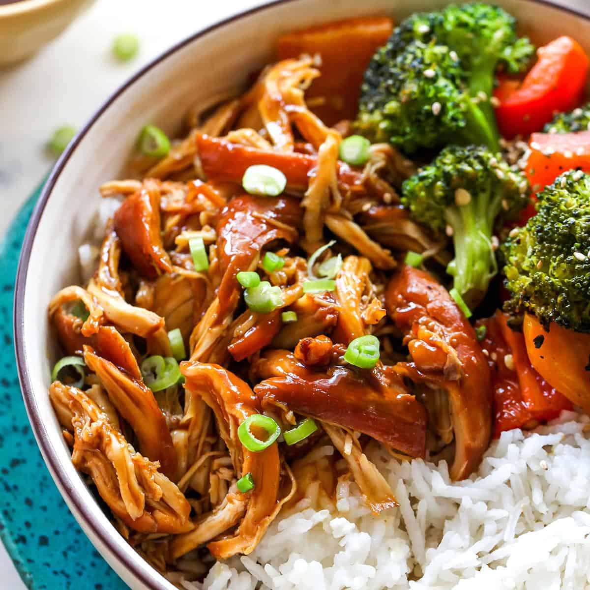 Crock Pot Teriyaki Chicken in a bowl with rice and vegetables 