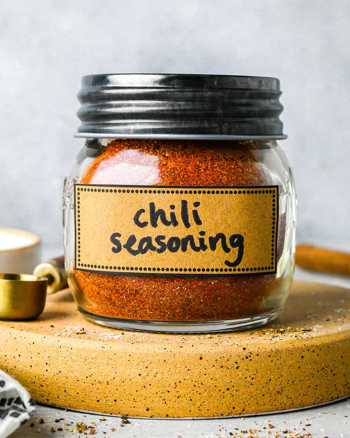 Homemade Chili Seasoning mix in a glass jar with a label and a lid