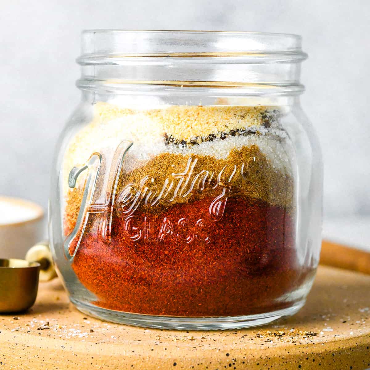 Homemade Chili Seasoning Recipe ingredients in a glass jar before shaking