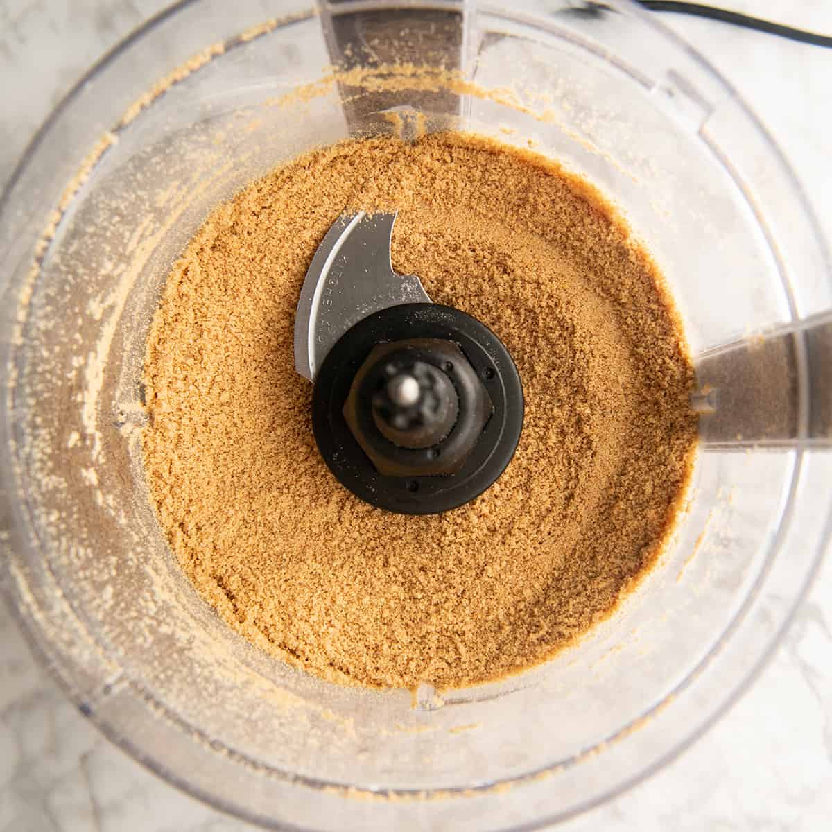 making graham cracker crumbs in a food processor to use to make chocolate peanut butter balls