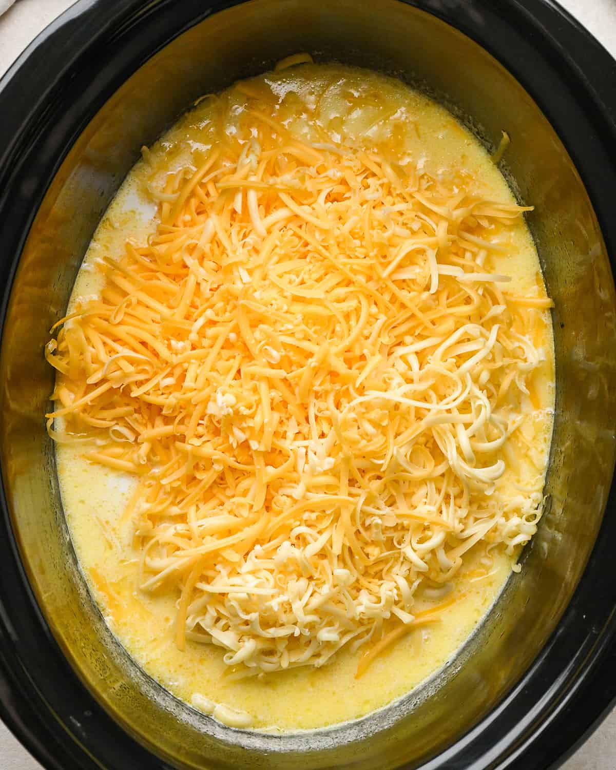 adding cheese to slow cooker mac and cheese