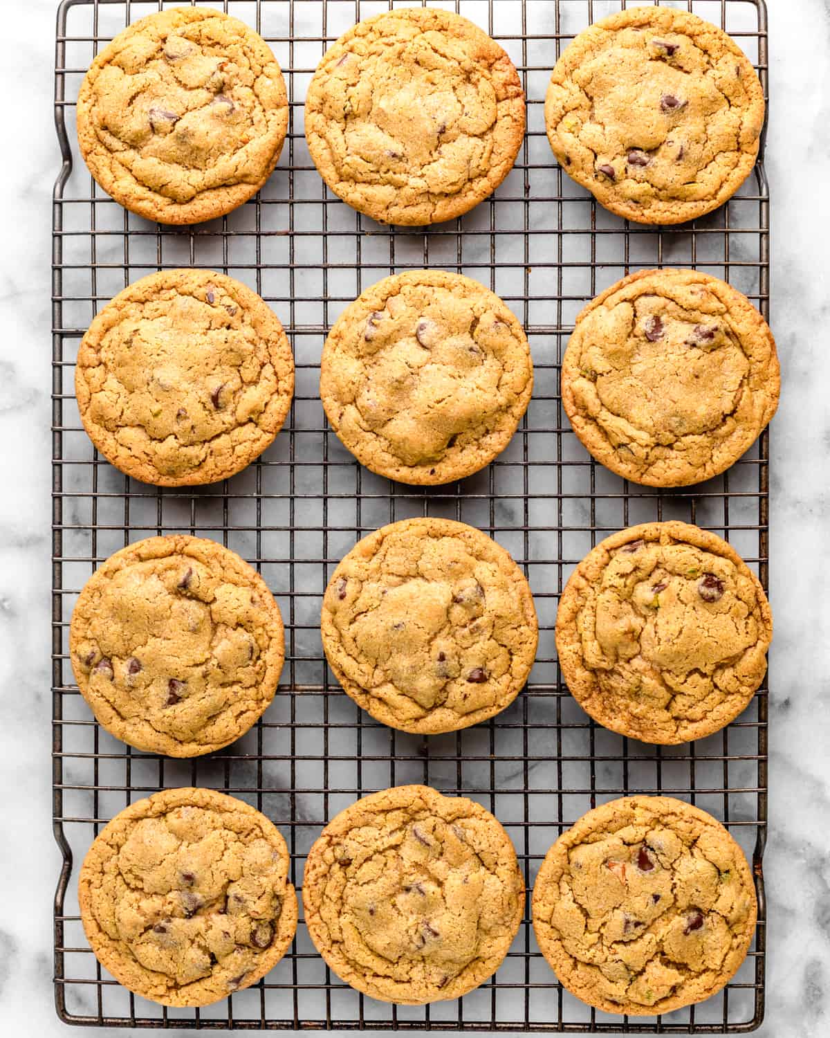 12 Pistachio Cookies on a wire cooling rack