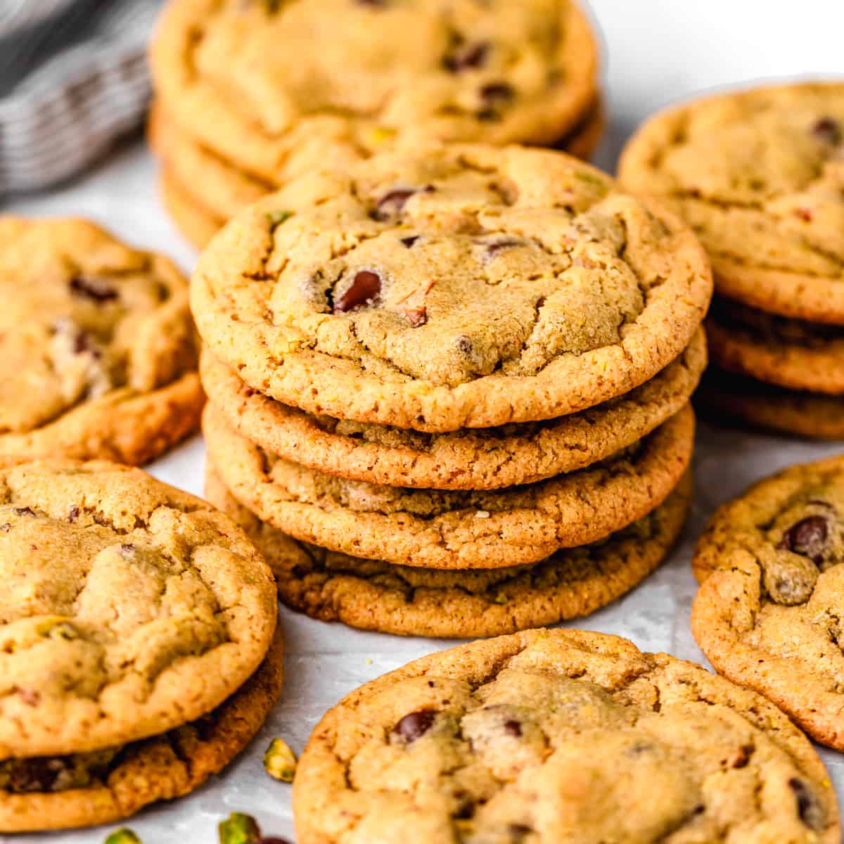 a stack of 4 Pistachio Cookies surrounded by other Pistachio Cookies