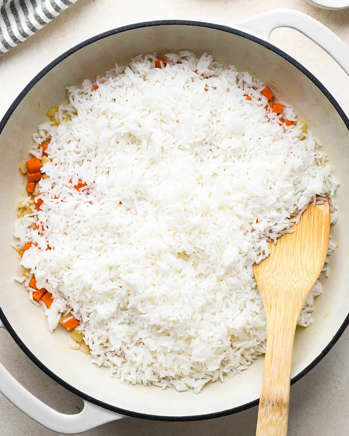 How to Make Fried Rice - white rice on top of the vegetables before mixing