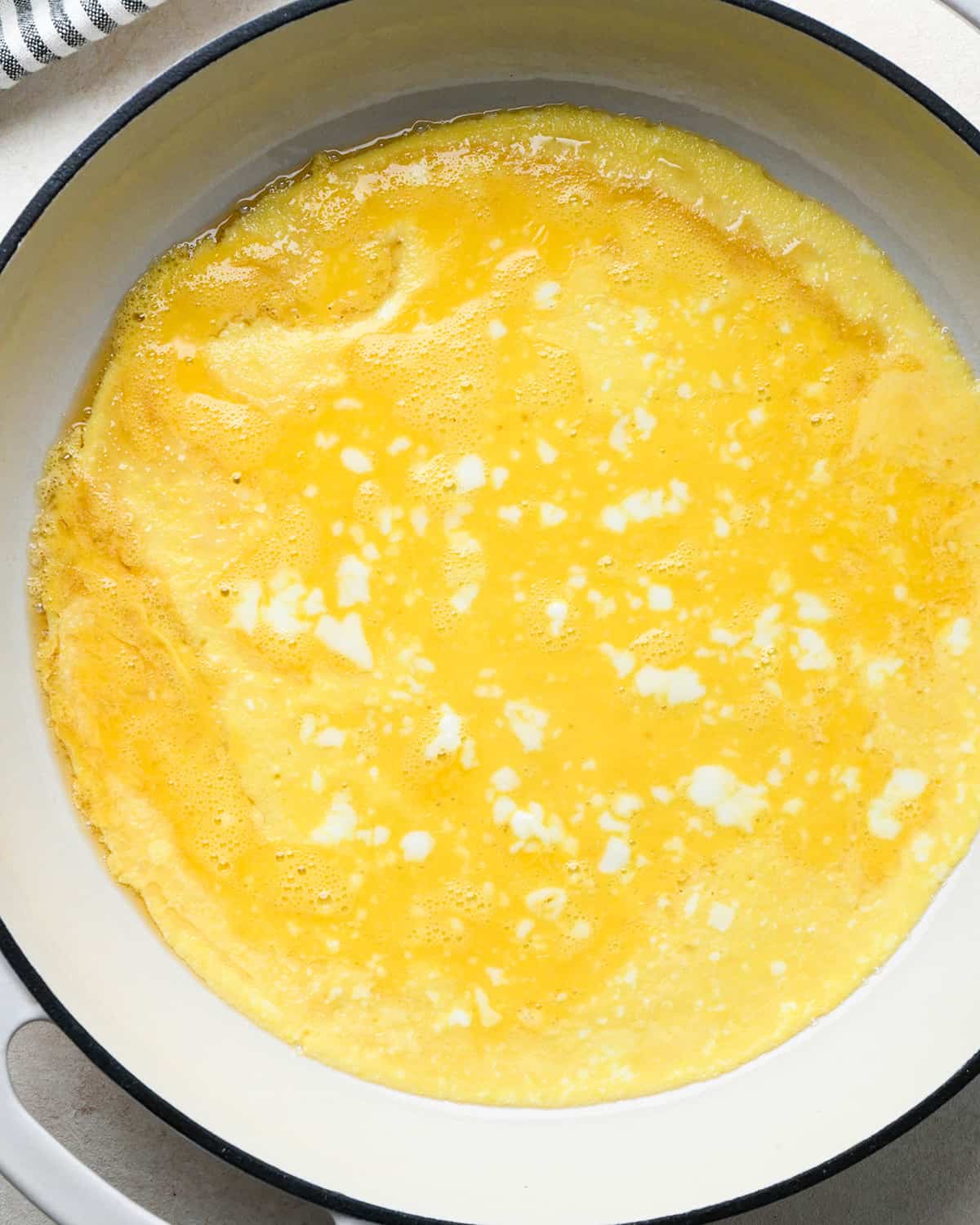 eggs cooking in a pan for fried rice
