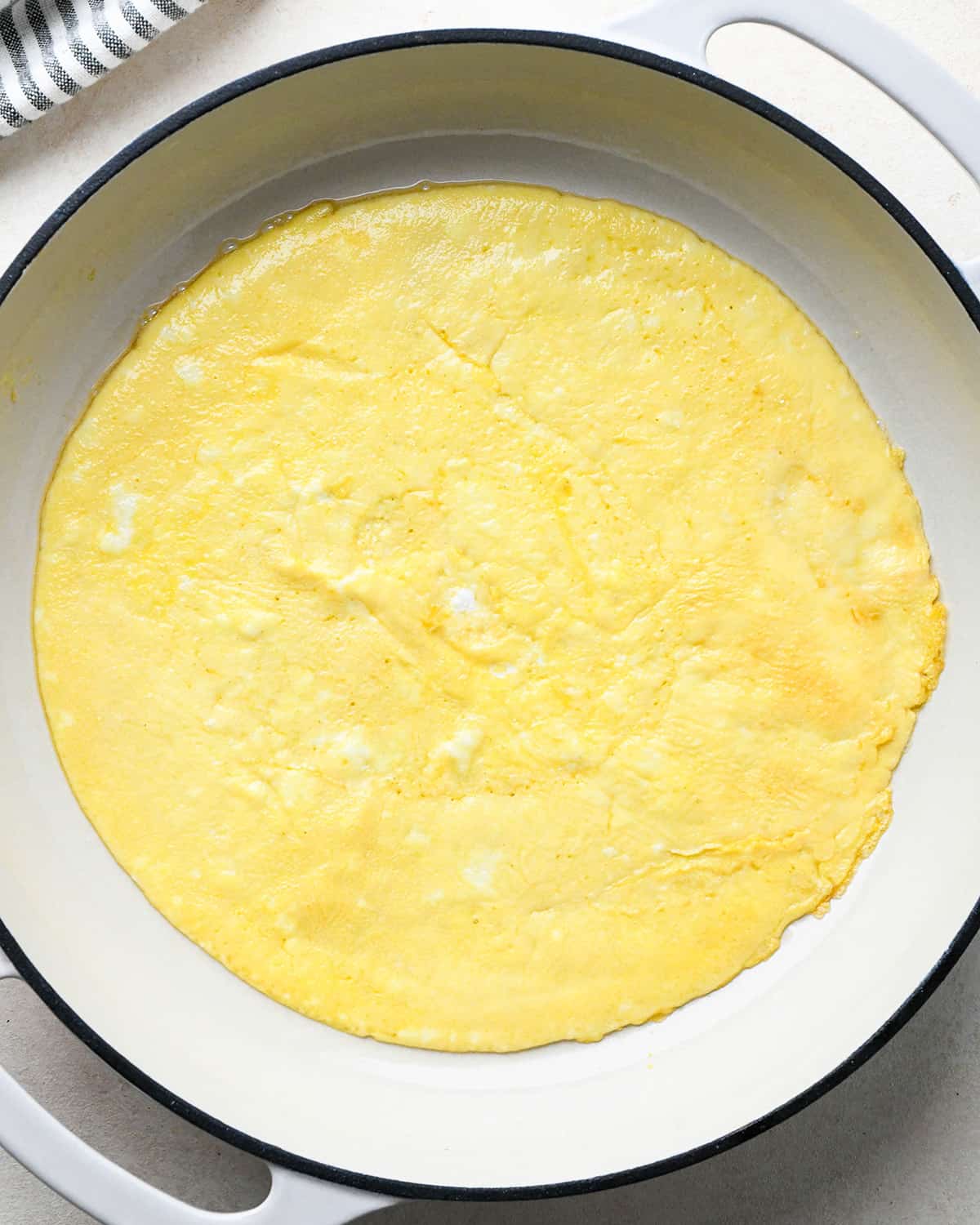 cooked eggs in a pan to use in fried rice