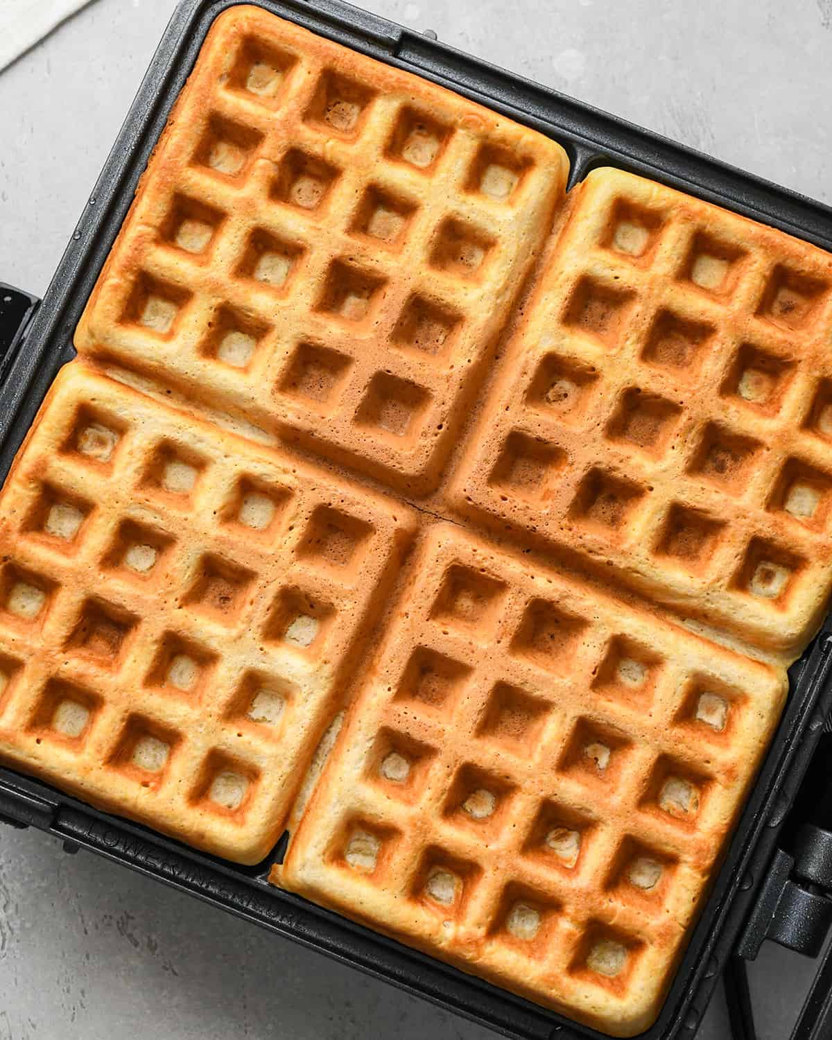 cooked waffles in a waffle maker 