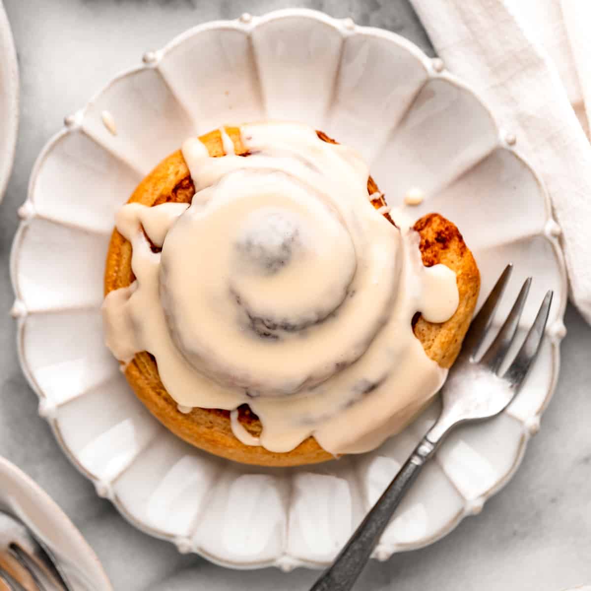 overhead photo of a cinnamon roll topped with Maple Glaze