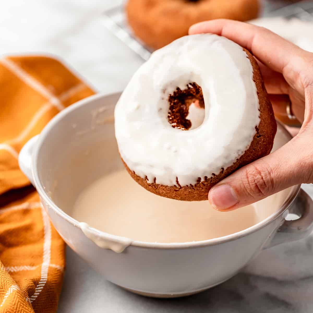 a donut dipped in Maple Glaze